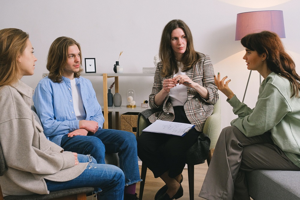 young-adults-in-family-counselling-session-with-female-counsellor